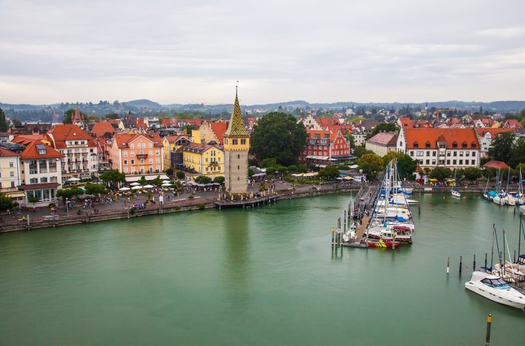 Lindau's beautiful harbor and old lighthouses make it a charming town to visit. - floating cities