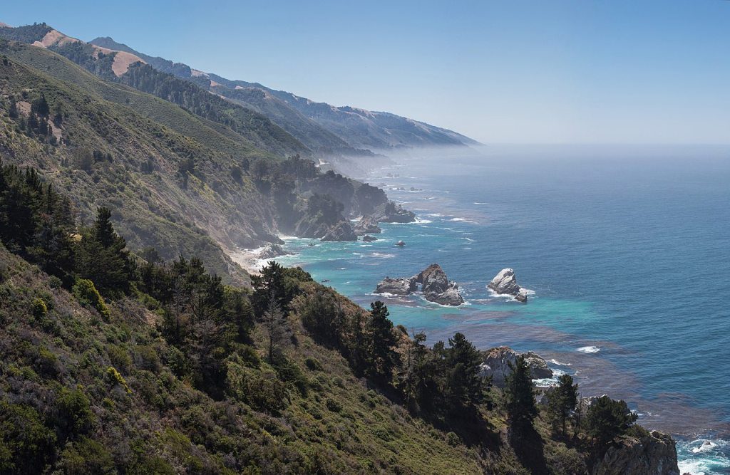 Central Californian coastline looking south, with the McWay Rocks (with arch) in the foreground, and McWay Cove in the center