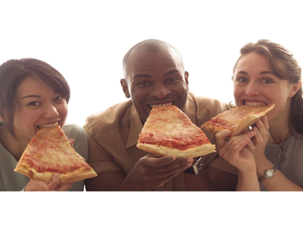 People eating pizza Boston food tour